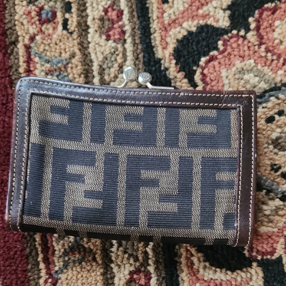 Fendi Black and Brown Logo Clutch Has Flaws